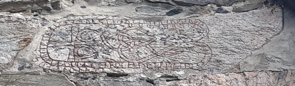 rune stone in church gable
